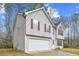 Two-story house with attached garage and red shutters at 6207 Willowbrook Dr, Riverdale, GA 30296