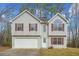 Two-story house with attached garage and red shutters at 6207 Willowbrook Dr, Riverdale, GA 30296
