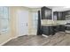 Eat-in kitchen with dark cabinets and granite countertops at 6207 Willowbrook Dr, Riverdale, GA 30296