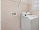Laundry room with washer, dryer, and overhead shelving at 6207 Willowbrook Dr, Riverdale, GA 30296