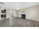 Open concept living room with fireplace and neutral walls at 6207 Willowbrook Dr, Riverdale, GA 30296