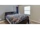 Bright bedroom with a double bed and window coverings at 3640 Sycamore Bnd, Decatur, GA 30034