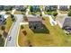 Aerial view showcasing a large backyard, well-manicured lawn, and neighborhood street at 4302 Maclaren Ct, Powder Springs, GA 30127