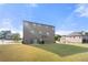 View of backyard featuring a spacious lawn and a gazebo, perfect for outdoor entertaining at 4302 Maclaren Ct, Powder Springs, GA 30127