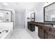 Spa-like bathroom with double vanity and granite top at 4302 Maclaren Ct, Powder Springs, GA 30127