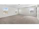 Spacious bedroom with neutral carpeting and multiple windows at 4302 Maclaren Ct, Powder Springs, GA 30127