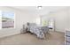Cozy bedroom with floral bedding and a full-length mirror at 4302 Maclaren Ct, Powder Springs, GA 30127