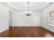 Formal dining room with hardwood floors and a chandelier at 4302 Maclaren Ct, Powder Springs, GA 30127
