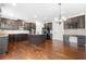 Spacious kitchen with dark brown cabinets and granite island at 4302 Maclaren Ct, Powder Springs, GA 30127