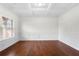 Spacious living room with hardwood floors and white walls at 4302 Maclaren Ct, Powder Springs, GA 30127