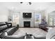 Spacious living room with fireplace and large sectional sofa at 4302 Maclaren Ct, Powder Springs, GA 30127