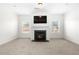 Bright living room featuring a modern fireplace at 4302 Maclaren Ct, Powder Springs, GA 30127