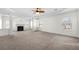 Large main bedroom with carpeted floor and fireplace at 4302 Maclaren Ct, Powder Springs, GA 30127
