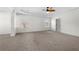 Spacious main bedroom with plush carpet and ceiling fan at 4302 Maclaren Ct, Powder Springs, GA 30127