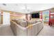 Spacious theater room with large sectional sofa and NFL team themed walls at 4302 Maclaren Ct, Powder Springs, GA 30127