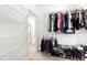 Well-organized walk-in closet with shelving and rods at 4302 Maclaren Ct, Powder Springs, GA 30127