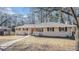 Brick ranch house with red door and walkway at 475 Shannon Way, Lawrenceville, GA 30044