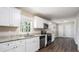 Kitchen with white cabinets, granite counters, and stainless steel appliances at 475 Shannon Way, Lawrenceville, GA 30044