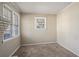 Bright living room with neutral walls and carpet at 475 Shannon Way, Lawrenceville, GA 30044