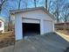 Spacious two-car garage with open doors and concrete floor at 56 Windom Dr, Carrollton, GA 30116