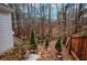 Landscaped backyard with stone steps and wooded area at 2530 Ashbourne Dr, Lawrenceville, GA 30043
