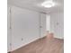 Spacious, blank basement room with wood-look flooring and neutral walls at 2530 Ashbourne Dr, Lawrenceville, GA 30043