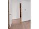 Simple basement room with wood-look flooring and access to utilities at 2530 Ashbourne Dr, Lawrenceville, GA 30043