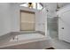 Spa-like bathroom with soaking tub, walk-in shower, and window at 2530 Ashbourne Dr, Lawrenceville, GA 30043