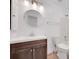 Clean bathroom, featuring a vanity with a modern mirror at 2530 Ashbourne Dr, Lawrenceville, GA 30043