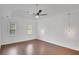 Bright bedroom featuring wood floors, ceiling fan and pendant lights at 2530 Ashbourne Dr, Lawrenceville, GA 30043