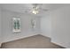 Bright bedroom with neutral walls, carpet, and ceiling fan at 2530 Ashbourne Dr, Lawrenceville, GA 30043