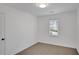 Simple bedroom with a window, carpet, and neutral walls at 2530 Ashbourne Dr, Lawrenceville, GA 30043