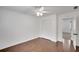 Bedroom with wood floors, ceiling fan, and access to another room at 2530 Ashbourne Dr, Lawrenceville, GA 30043
