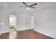 Spacious bedroom with ceiling fan, wood floors, and ensuite bathroom at 2530 Ashbourne Dr, Lawrenceville, GA 30043