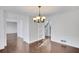 Dining room with hardwood floors, chandelier, and wainscoting at 2530 Ashbourne Dr, Lawrenceville, GA 30043