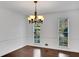 Bright dining room with hardwood floors and large windows at 2530 Ashbourne Dr, Lawrenceville, GA 30043