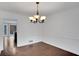 Hardwood floor dining room with view into kitchen at 2530 Ashbourne Dr, Lawrenceville, GA 30043
