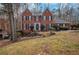 Brick two-story house with a landscaped yard at 2530 Ashbourne Dr, Lawrenceville, GA 30043