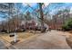 Landscaped yard with driveway, mailbox, and trees at 2530 Ashbourne Dr, Lawrenceville, GA 30043