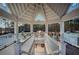 Gazebo interior with seating and tennis court view at 2530 Ashbourne Dr, Lawrenceville, GA 30043