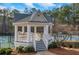 White gazebo with white railings and stairs at 2530 Ashbourne Dr, Lawrenceville, GA 30043