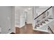 Bright hallway with hardwood floors and built-in shelving at 2530 Ashbourne Dr, Lawrenceville, GA 30043