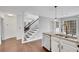 Kitchen with island, stainless steel dishwasher, and hardwood floors at 2530 Ashbourne Dr, Lawrenceville, GA 30043