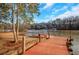Expansive wooden dock extending over calm lake water at 2530 Ashbourne Dr, Lawrenceville, GA 30043