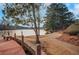 Peaceful lakeside walking path with wooden dock at 2530 Ashbourne Dr, Lawrenceville, GA 30043