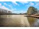 Serene lake view with a wooden boardwalk at 2530 Ashbourne Dr, Lawrenceville, GA 30043