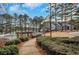 Community pool and clubhouse with a scenic lakeside view at 2530 Ashbourne Dr, Lawrenceville, GA 30043