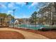 Community pool with lakeside views and a pool house at 2530 Ashbourne Dr, Lawrenceville, GA 30043