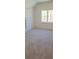 Bright bedroom featuring neutral paint and carpet, closet, and large windows at 4525 Aiden Way, Cumming, GA 30041