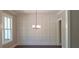 Dining room with modern chandelier and elegant wall trim at 4525 Aiden Way, Cumming, GA 30041